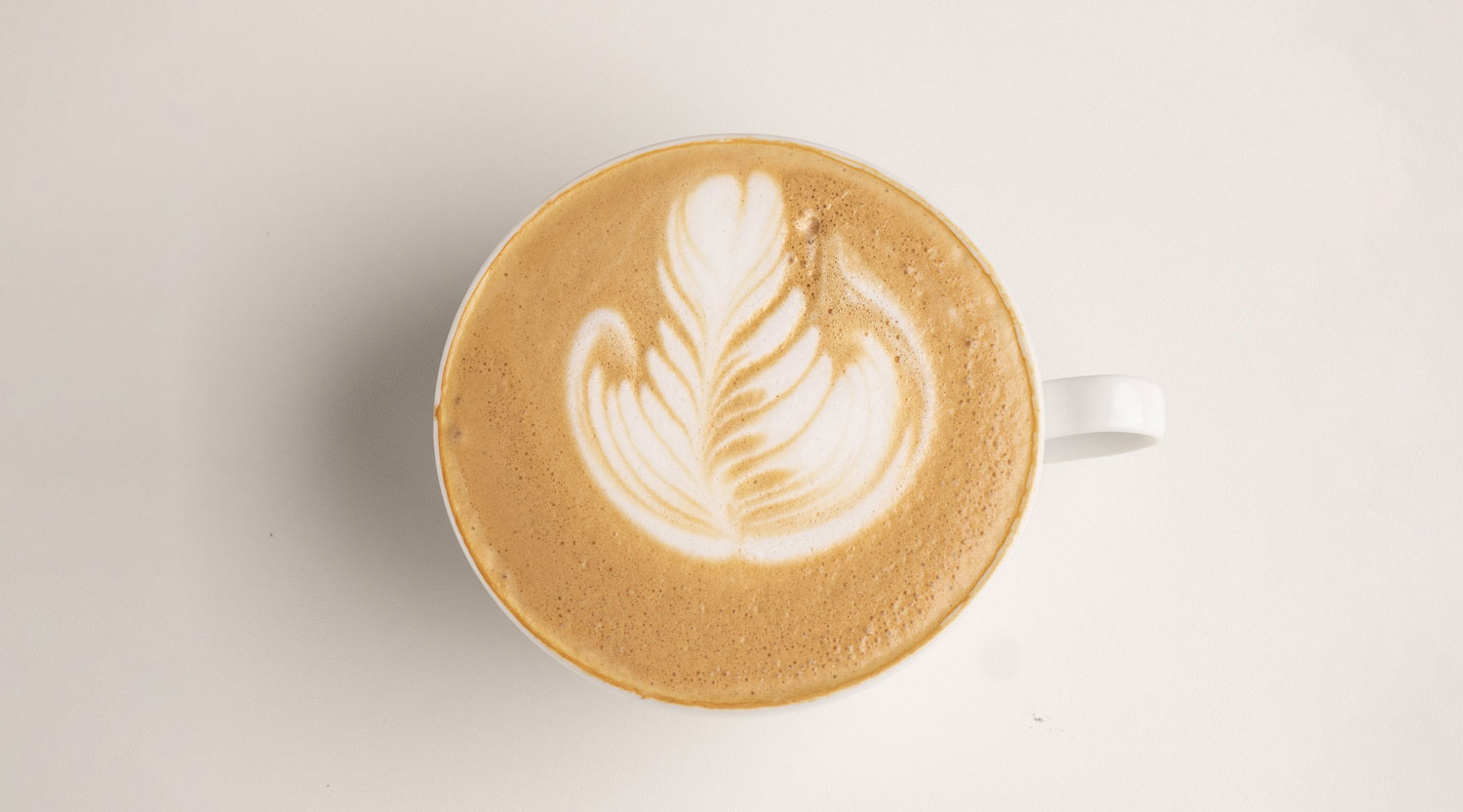 Hand crafted espresso latte specialty coffee beverage in Park City Utah coffee shop